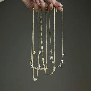 Selection of golden S925 silver necklaces with olive leaf and heart pendants