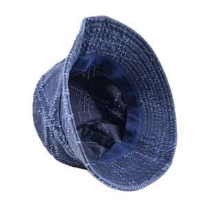 Detail of navy blue washed bucket hat with white stitching and reinforced inner lining