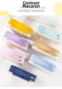 Macro view of multi-layer macaron canvas pencil cases in various contrast colors