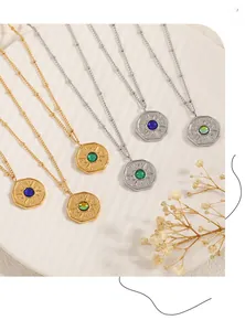Detailed close-up of octagonal sunburst pendants with colorful stones on beaded chains