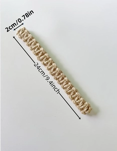 Detail view of beige braided cotton jute curtain tieback with 24cm length measurements
