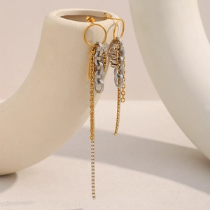 Detail view of 18K gold plated tassels and zirconia chains on vintage style earrings