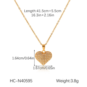 Macro view of gold heart pendant necklace with dimensions and sparkling zircon pavé