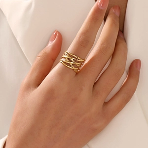 18K gold plated stainless steel multi-layer crossover ring worn on a female hand