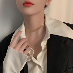 Elegant gold-tone braided mesh titanium steel necklace worn on a model in chic style