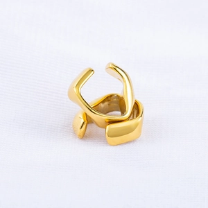 Minimalist gold-plated stainless steel ear cuff with geometric twisted architectural design