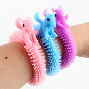Three colorful unicorn stress relief bracelets in pink, blue and purple TPR material