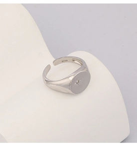Detailed close-up showing S925 hallmark on polished silver ring with star diamond