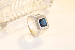 Macro side view of men's square blue sapphire ring with micro-pave zircon crystals