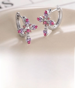 Detail of silver cross hoop earring with pink and purple zircons, 10mm inner diameter
