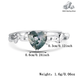 Macro detail of S925 silver ring featuring heart-shaped moss agate with size markings