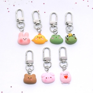 Cute resin cartoon animal keychains featuring pig rabbit and frog charms for bags