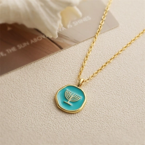 Fashionable gold necklace with blue enamel pendant featuring a Jewish Menorah motif