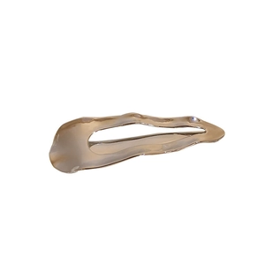 Sleek silver wave-shaped metal hair clip with a polished finish for minimalist styling