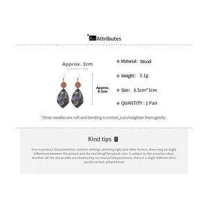 Detail view of teardrop wooden floral earrings showing size 8.5cm by 3cm and 3.1g weight