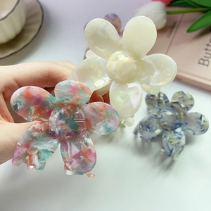 Elegant acetate flower hair claws with marble texture and pearlescent finish for women