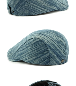 Détails d'une casquette en jean montrant le profil, la texture et la boucle en métal