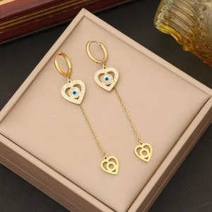 Golden long heart tassel earrings with blue evil eye charms and crystal accents