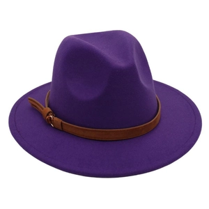 Detailed macro view of purple wool fedora hat texture and brown faux leather belt buckle