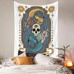 Detailed view of tarot tapestry with mermaid and skull design in a cozy bedroom setting