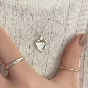 Minimalist 925 sterling silver irregular heart necklace with July engraving on model
