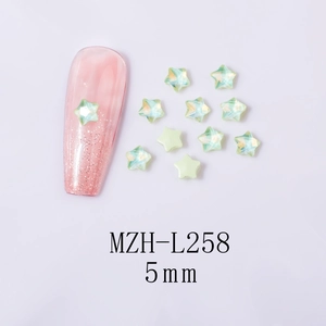 Detailed close-up of iridescent green 5mm star-shaped K9 glass rhinestones for nail art