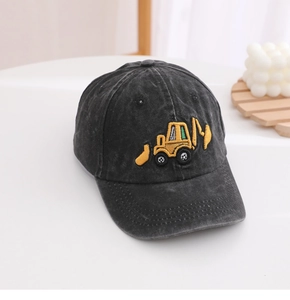 Detail of yellow excavator embroidery on washed denim baseball cap for boys