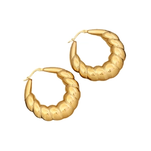 Polished chunky gold hoop earrings with wave texture on a clean white background