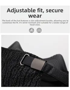 Detail of adjustable leather strap and matte silver metal buckle on black baseball cap