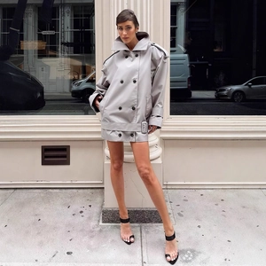 Chic grey double-breasted trench coat jacket with lapel and belt for modern urban style