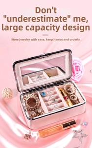 Schmuckkästchen aus rosa Leder mit Schminkspiegel und Samtfächern für Ringe