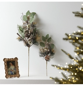 Detailed view of Christmas floral picks with pine cones, golden balls, and eucalyptus leaves