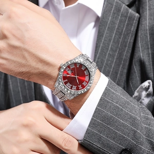 Silver iced-out men's watch with red Roman dial and crystal-encrusted steel strap