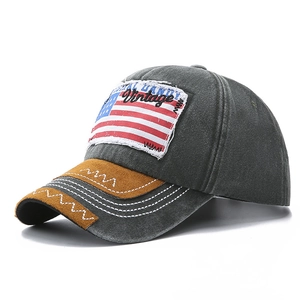 Vintage washed charcoal baseball cap with USA flag patch and brown suede brim detailing