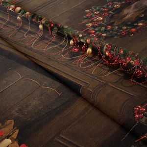 Close-up of bohemian Christmas tapestry fabric showing festive wreath print and texture