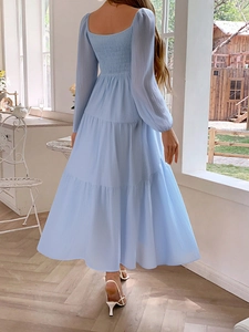 Detail of light blue tiered maxi dress with shirred elastic back and square neckline