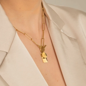 Gold paperclip necklace with toggle clasp and dual square-round tag pendants