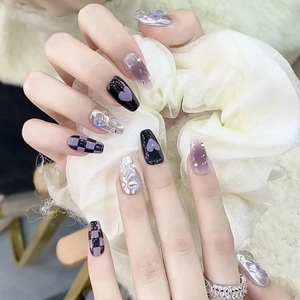 Handmade press-on nails with purple checkerboard, heart motifs, and 3D butterfly charms