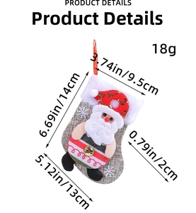 Detailed view of burlap Christmas mini stocking with plush Santa and gold bell hanging ornament