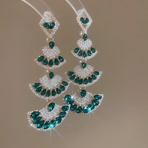 Luxurious gold-plated chandelier earrings with emerald green teardrops and pavé zircon