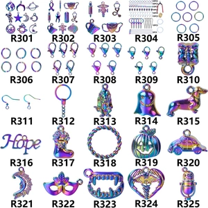 Macro view of assorted rainbow plated metal charms with moon and star shapes
