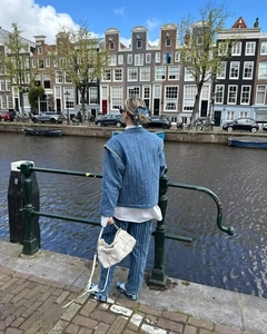 Quilted blue denim jacket with contrast stitching and open front in a European street style