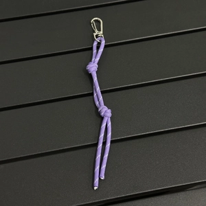 Detail of purple reflective woven cord lanyard with durable silver metal snap hook