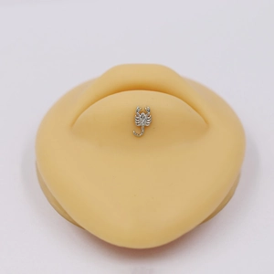 Surgical steel scorpion labret stud with zircon stones on silicone display