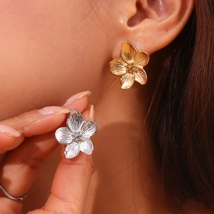 3D flower stud earrings in gold and silver finish with brushed metal texture