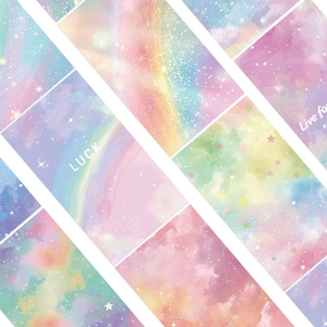 Macro detail of dreamlike pastel starry sky stickers with LUCK lettering for journals