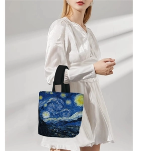 Detail of Starry Night print on vintage canvas bucket bag with black handle