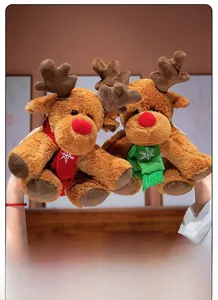 Detail showing plush Christmas reindeer dolls with red and green snowflake scarves