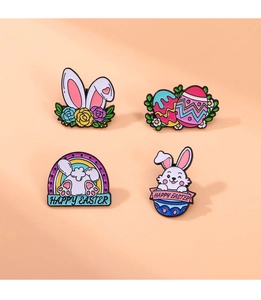 Set of four colorful Easter bunny and egg enamel pins with Happy Easter text engraving