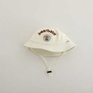 Detail of adjustable windproof strap and bear embroidery on toddler bucket hat